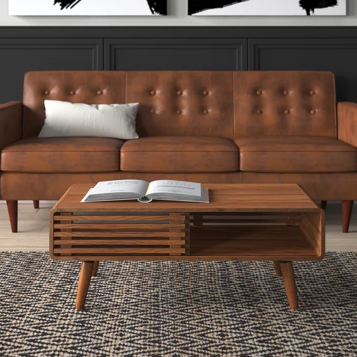 Classic wooden coffee table with storage. Not only does the wooden slideable spacing make it aesthetic but the colour goes with a variety of interior decor finds