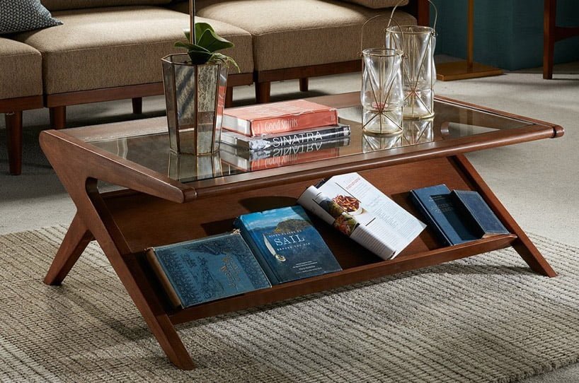 Mid century coffee tables can be styled in varying ways. This image showcases different plants, vases and books utilising its multiple storage facilities such that the table helps your personality shine through while adding visually interesting elements.